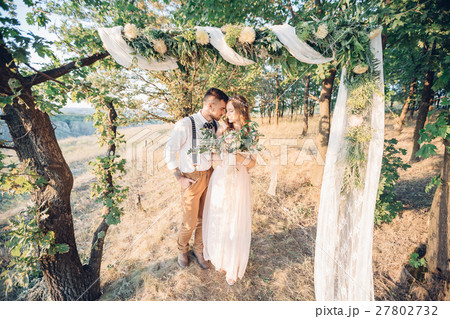 bride and groom hugging at the wedding in nature. 27802732