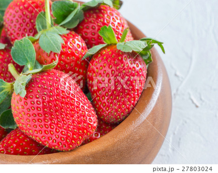 strawberries in wooden bowl strawberries in wooden bowl 27803024