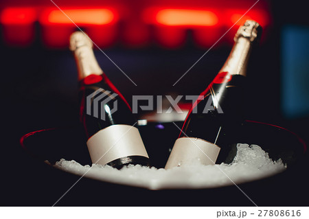 Two bottles of champagne in a bucket 27808616