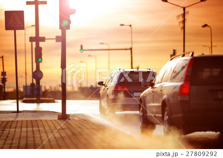 Cars moving on the road in city in early morning Cars moving on the road in city in early morning 27809292