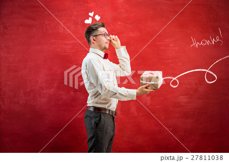 Young funny man with gift 27811038