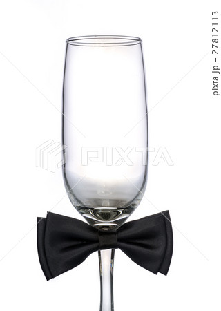 empty champagne glass with bow tie 27812113