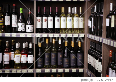 Wine bottles in wine shop 27812447