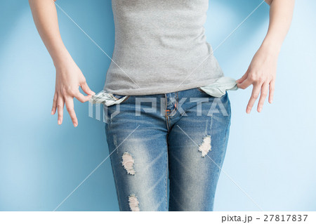 woman showing her empty pockets woman showing her empty pockets 27817837