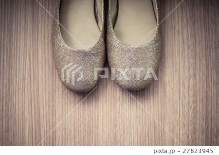 Women shoes old on a wood background 27823945
