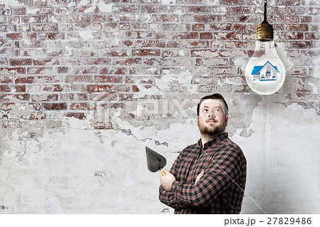 Handyman with tool in interior Handyman with tool in interior 27829486