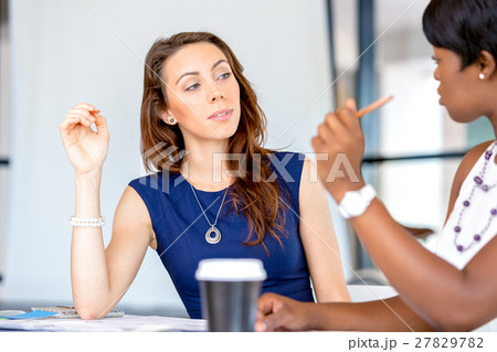 Women working together, office interior 27829782