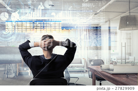 Businessman relaxing in his office mixed media 27829909