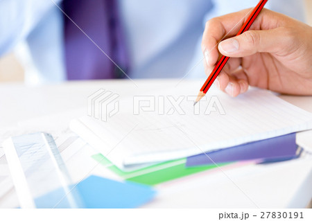 Close upof hands writing 27830191