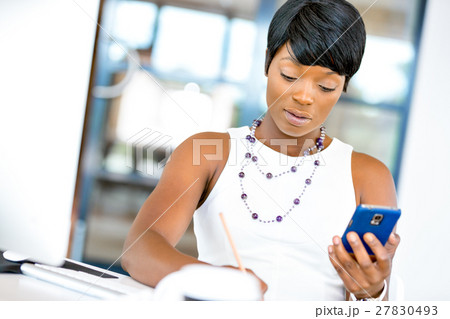 Portrait of smiling business woman with mobile 27830493