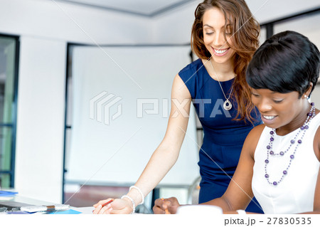 Women working together, office interior Women working together, office interior 27830535