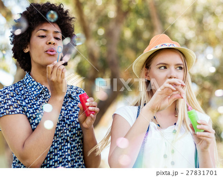 Two women friends in park Two women friends in park 27831701