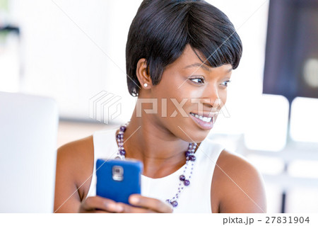 Portrait of smiling business woman with mobile Portrait of smiling business woman with mobile 27831904