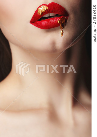 Girl with red lips and liquid paint 27833410