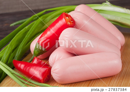 heap of sausages with spring onion and chilli on a 27837384