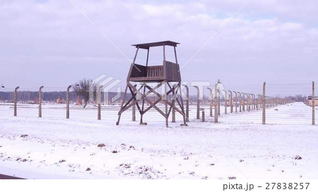 Steadicam shot of old guard tower and barbed wire Steadicam shot of old guard tower and barbed wire 27838257