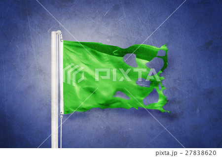 Torn green flag flying against grunge background Torn green flag flying against grunge background 27838620