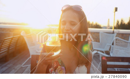 Portrait of beautiful young woman drinking wine 27840090
