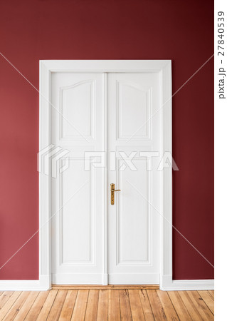 white door on red wall white door on red wall 27840539
