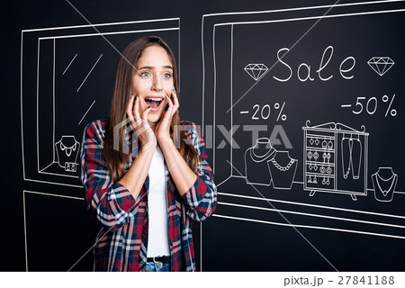 Pleasant surprised woman shopping 27841188