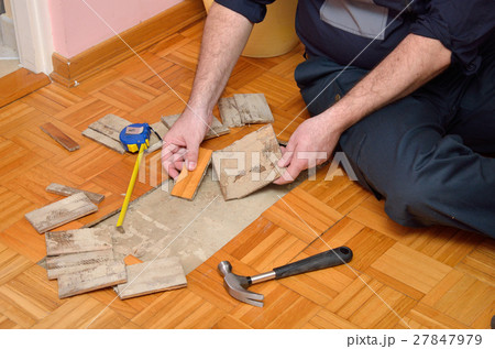 Man Removing Damaged Parquet Man Removing Damaged Parquet 27847979