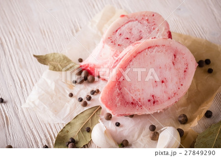 Big pieces of marrowbone on white wooden board 27849290