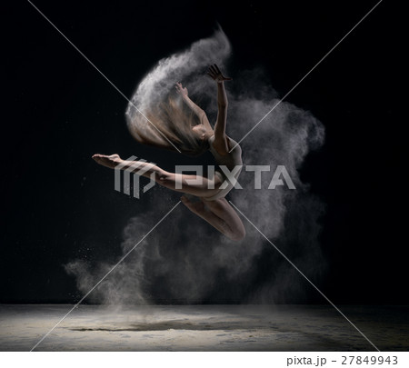 Girl in body jumps in dust cloud black background Girl in body jumps in dust cloud black background 27849943