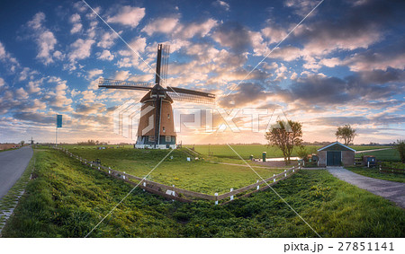 Windmill at sunrise in Netherlands. dutch windmill Windmill at sunrise in Netherlands. dutch windmill 27851141