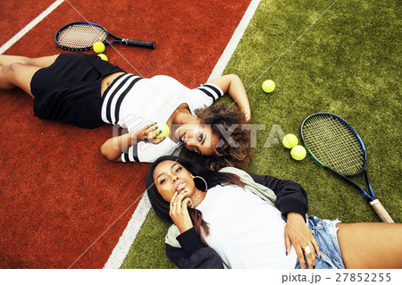 young pretty girlfriends hanging on tennis court 27852255