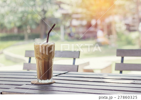 Ice coffee on a wooden table 27860325