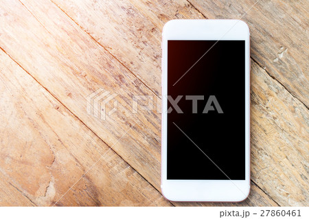 Mobile phone with blank screen mockup on wood table background, clipping path inside Mobile phone with blank screen mockup on wood table background, clipping path inside 27860461