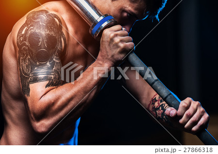 Strong muscular man with holding barbell Strong muscular man with holding barbell 27866318