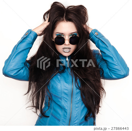 Girl in a blue jacket and glasses 27866443