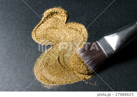 Cosmetic brush with golden eyeshadow 27866625