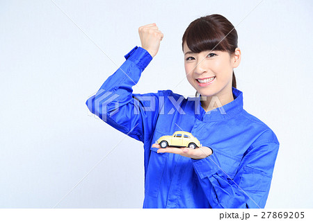 つなぎと車と女性の写真素材