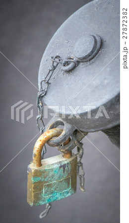Hanging padlock on a water construction attachment 27872382