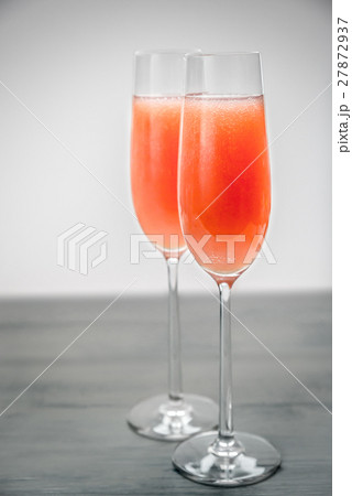 Two glasses of bellini cocktail Two glasses of bellini cocktail 27872937