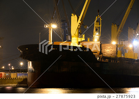 loading cargo ship with cranes is moored in port loading cargo ship with cranes is moored in port 27875923