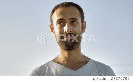 Cheerful man smiles with teeth and nods head Cheerful man smiles with teeth and nods head 27876793