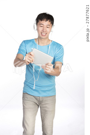 man playing with tablet man playing with tablet 27877621