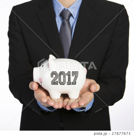 Man holding a piggy bank 27877673