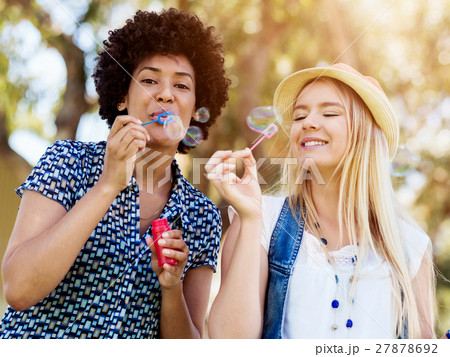 Two women friends in park Two women friends in park 27878692