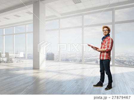 Hipster guy with book 27879467