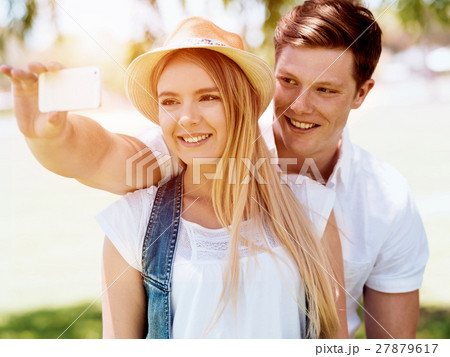 Young couple doing selfie outdoors Young couple doing selfie outdoors 27879617