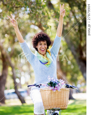 Happy young woman with bicycle 27879904