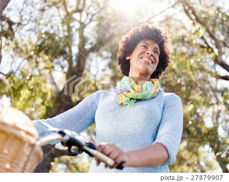 Happy young woman with bicycle Happy young woman with bicycle 27879907