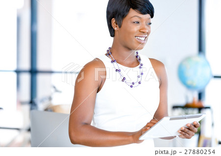 Young woman in office using tablet 27880254