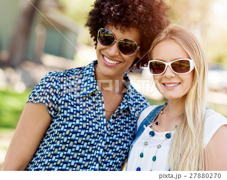 Two women friends in park Two women friends in park 27880270