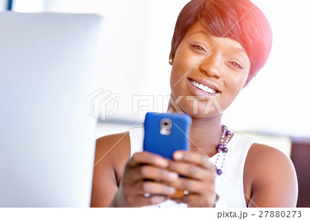 Portrait of smiling business woman with mobile 27880273