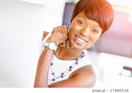 Portrait of businesswoman working at her desk in office Portrait of businesswoman working at her desk in office 27880516